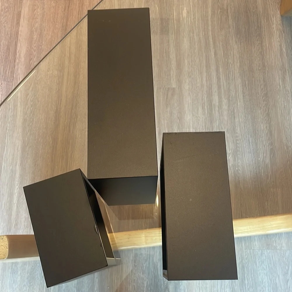3 black shelving units